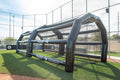 Rude American USA PRO inflatable batting cage, 18ft wide by 13ft tall, set up on a grass field