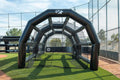 Baseball player taking batting practice inside the PRO XL commercial inflatable batting cage