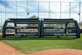 Angled view of the Small residential inflatable batting cage showing the raised, stake-free base rail